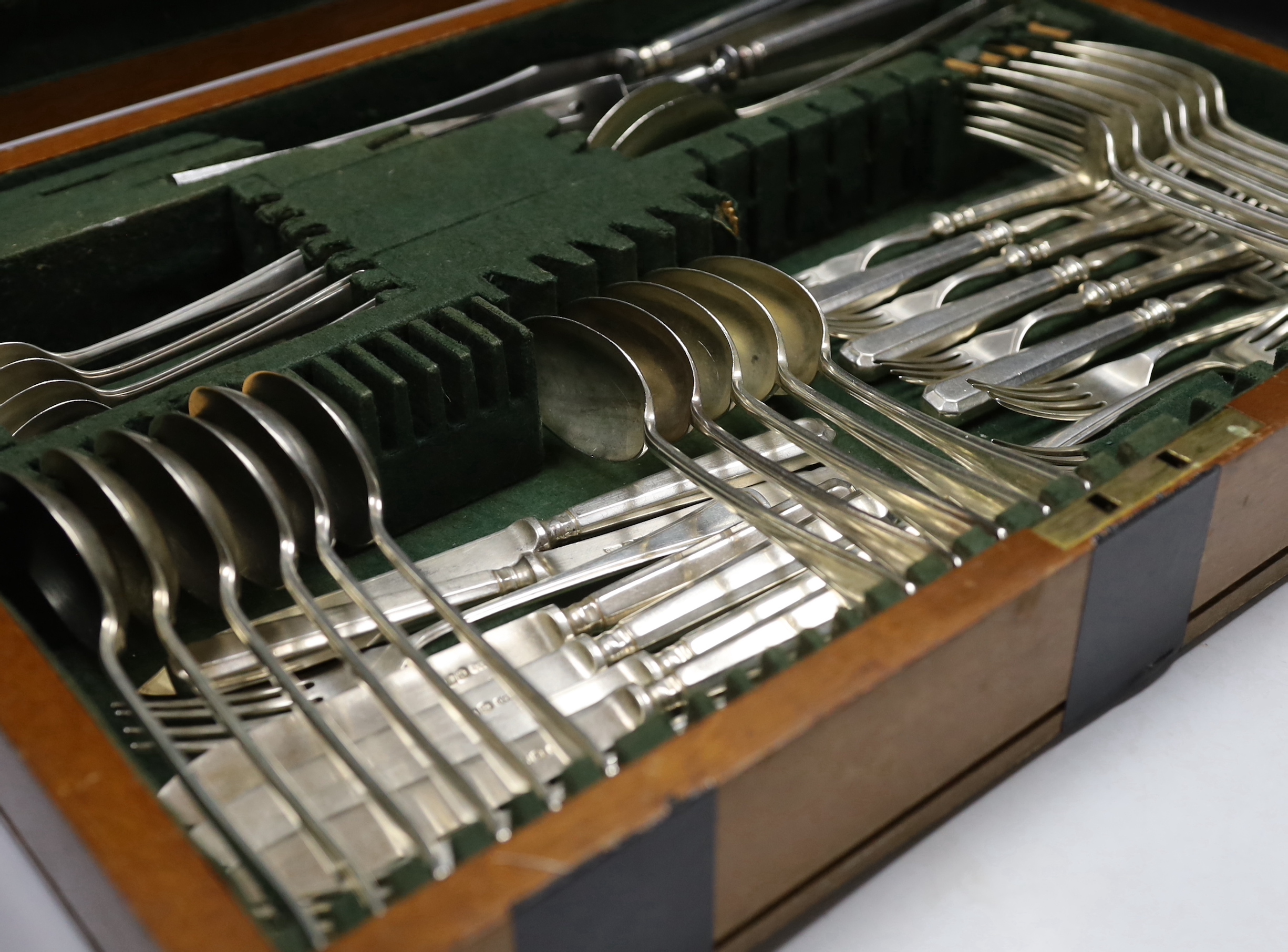 A part canteen of Elizabeth II silver cutlery for six by Gee & Holmes, comprising six each of the following, fish knives and forks, table and dessert forks, soup spoons, silver handled table and dessert knives, together